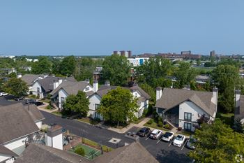 A residential area with houses and a basketball court